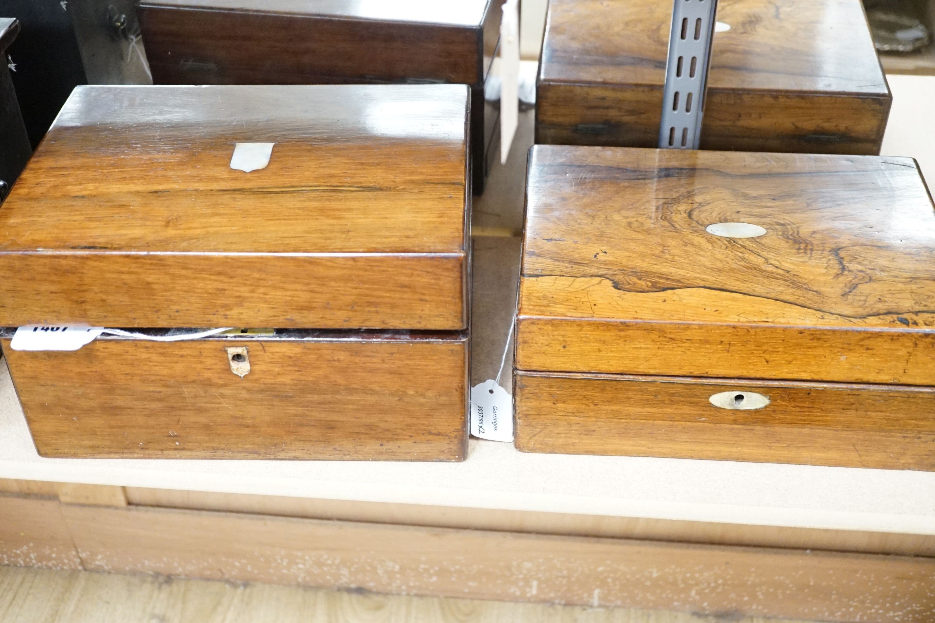 Two Victorian rosewood cased travelling vanity sets with silver plated covers (2)